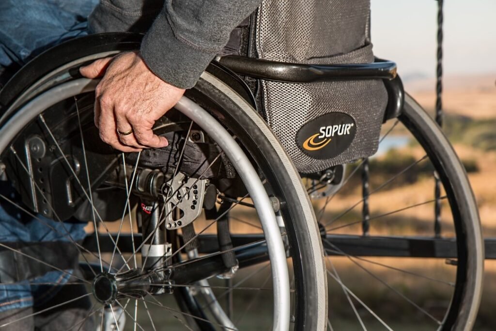 A man pushing himself in a wheelchair.
